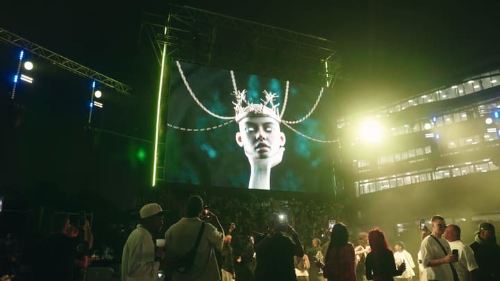 The LED wall above the crowd at Secrets of Summer after dark, lit green and cyan